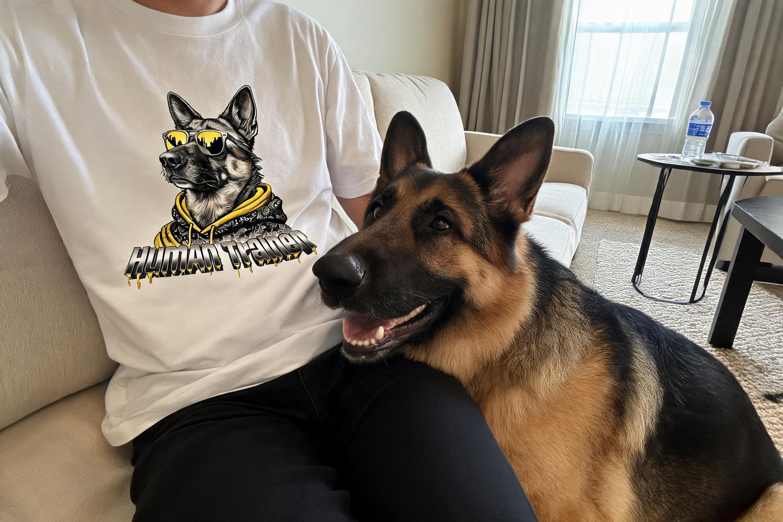 Woman wearing an oversized custom dog quote tee in a sunlit living room
